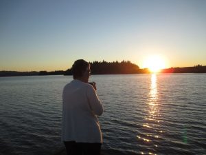 Martha Wasik enjoys the sunset at Silver Lake WA.